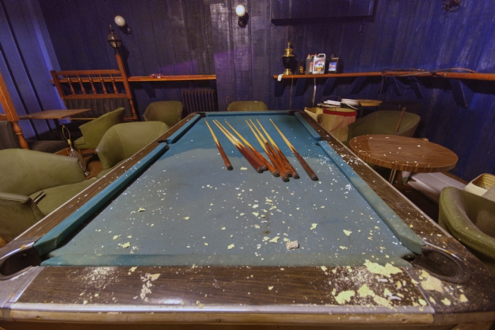 Pool table in abandoned hotel