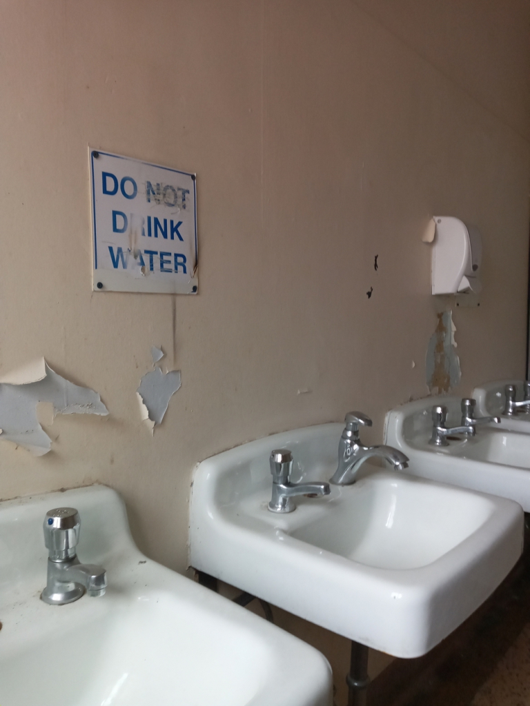 abandoned Leamington District Secondary School bathroom