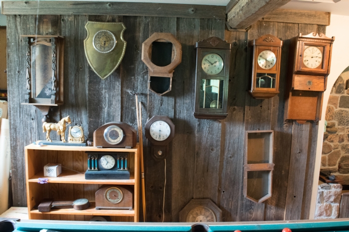 assorted clocks on the wall